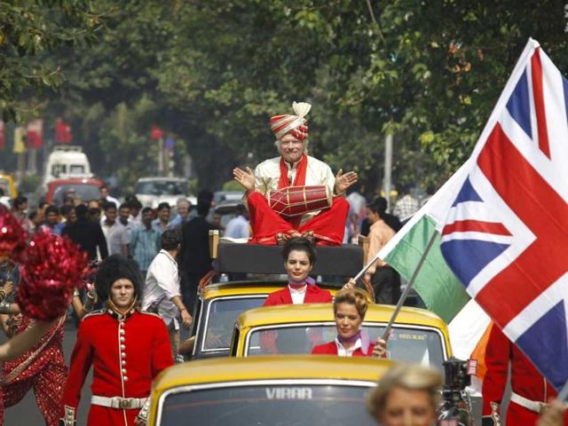 Virgin Group founder Richard Branson plays a dhol while sitting atop a taxi during a promotional event in Mumbai. Reuters/Danish Siddiqui