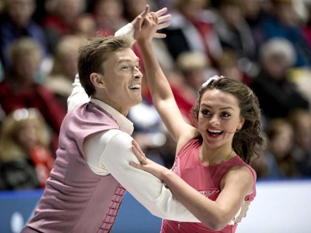 Ekaterina Riazanova, right, and Ilia Tkachenko, of Russia, perform their short routine in the ice dance competition at the Skate Canada figure skating event in Windsor, Ontario. (AP Photo)