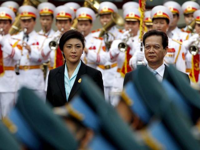 Thailand's Prime Minister Yingluck Shinawatra (L) reviews the guard of honour with her Vietnamese counterpart Nguyen Tan Dung during a welcoming ceremony in Hanoi. Yingluck Shinawatra is in Hanoi for the 2nd Vietnam and Thailand joint cabinets. (Reuters)