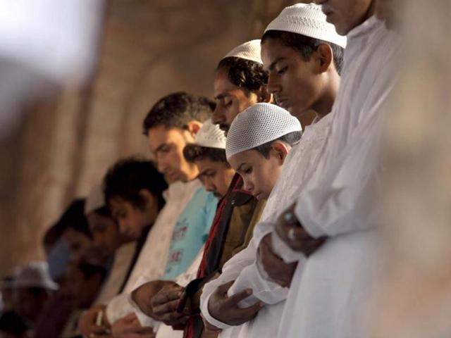 Muslim devotees offer Eid al-Adha prayers at Afsarwala Mosque in the grounds of the UNESCO World Heritage site Humayun's Tomb in New Delhi. Eid al-Adha, or the Feast of Sacrifice, honours Abraham's willingness to sacrifice his son Ishmael on the order of God, who according to tradition then provided a lamb in the boy's place. (AFP Photo)