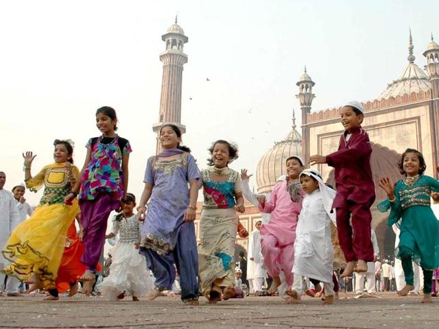 Children enjoying themselves after Eid al-Adha prayers at the Jama Masjid in Delhi. Agencies