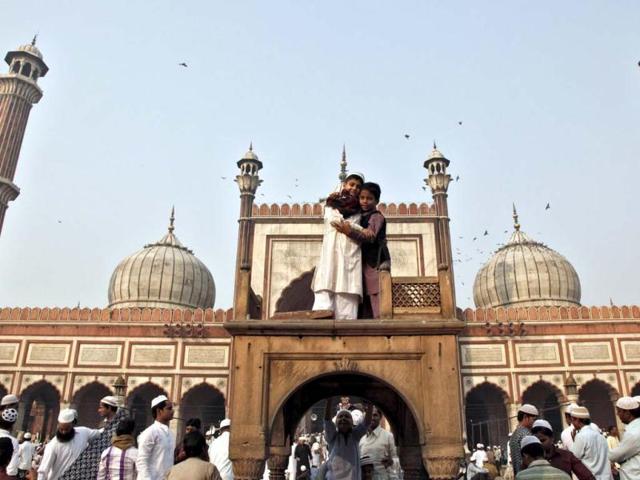 Muslim children hug each other after performing Eid al-Adha prayers at the Jama Masjid in the old quarters of Delhi. Reuters