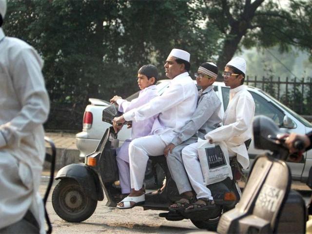 Muslims on their way to Feroz Shah Kotla to offer Eid-ul-Zuha prayers in New Delhi. PTI Photo