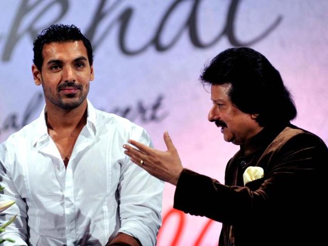 John Abraham with Pankaj Udhas. (Photo/AFP)