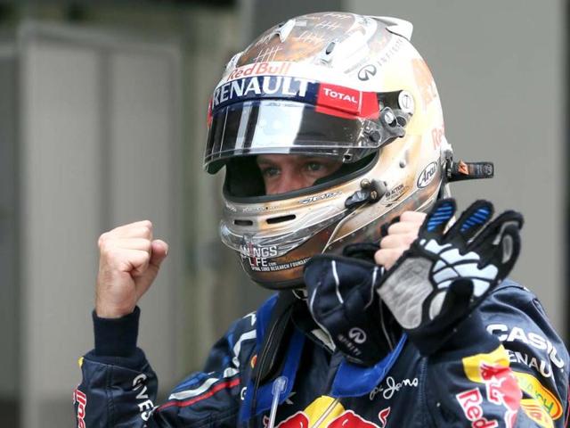 Red Bull driver Sebastian Vettel of Germany celebrates after winning the qualifying session for the Indian Formula One Grand Prix at the Buddh International Circuit in Noida, on the outskirts of New Delhi. AP Photo