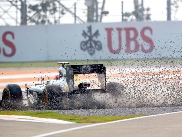 Caterham-Renault driver Heikki Kovalainen of Finland skids off the track during the qualifying session at The Buddh International circuit in Greater Noida, on the outskirts of New Delhi . AFP photo
