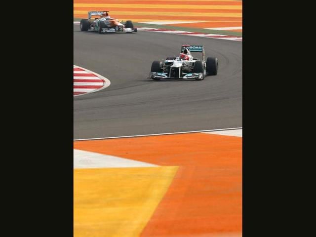 Mercedes driver Michael Schumacher of Germany leads Force India driver Paul di Resta of Britain during the qualifying session for the Indian Formula One Grand Prix at the Buddh International Circuit in Noida, on the outskirts of New Delhi. AP Photo