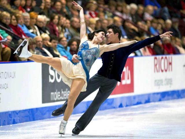 Canada's Tessa Virtue and Scott Moir perform their short routine in the ice dance competition at the Skate Canada figure skating event in Windsor, Ontario. AP/Paul Chiasson