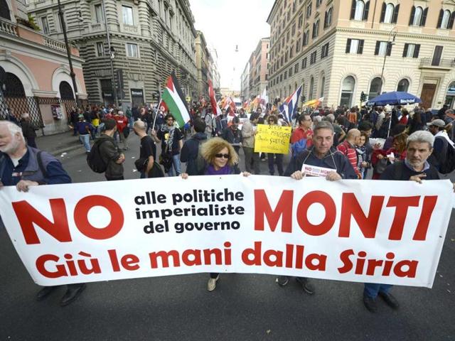 Demonstrators hold a banner reading 'No to the imperialsm of Monti's government, Take your hands off Syria' during the No Monti Day demonstration in Rome. AFP photo