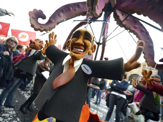 A puppet showing US President Barack Obama is displayed at the start of the No Monti Day demonstration in Rome. AFP photo