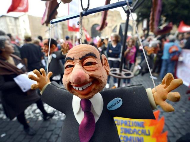 A puppet showing former Italian Prime Minister Silvio Berlusconi is displayed at the start of the No Monti Day demonstration in Rome. AFP photo
