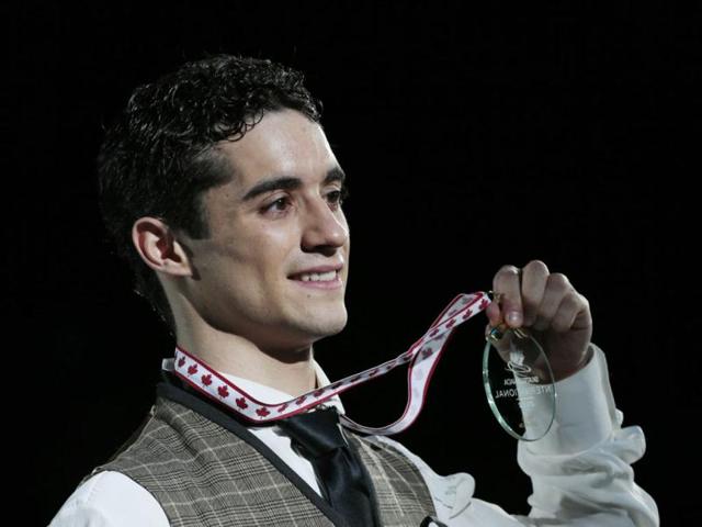 Gold medalist Javier Fernandez of Spain shows off his medal during the mens victory ceremony at the 2012 Skate Canada International ISU Grand Prix event in Windsor. AFP Photo