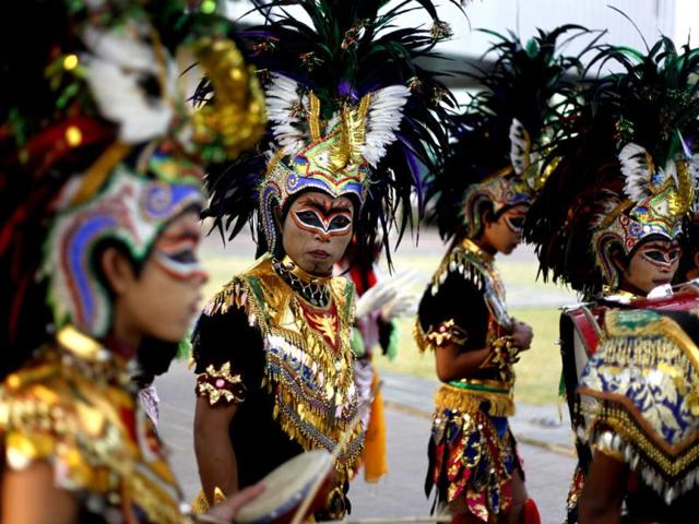 Performers prepare to perform during a cultural parade held to commemorate Youth Pledge Day in Jakarta. AP Photo