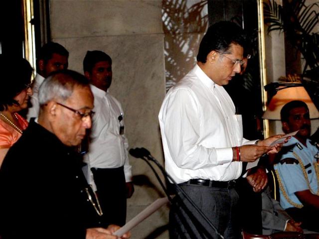Manish Tewari being sworn-in as a minister of state with independent charge by President Pranab Mukherjee during a ceremony at Rashtrapati Bhavan in New Delhi. PTI Photo