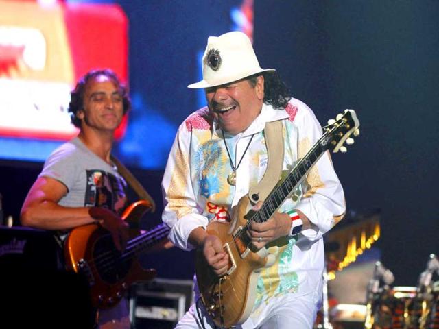 Musician Carlos Santana performs during his concert in Noida, on the out skirts of New Delhi. (AP Photo)