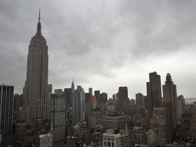 Storm clouds loom over the Empire State Building and Manhattan skyline in New York as Hurricane Sandy continued on its path forcing a mass shutdown. AP Photo