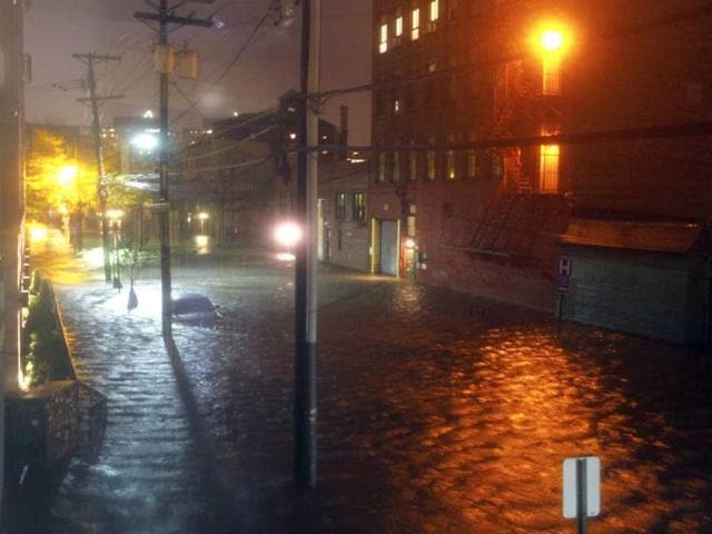 Flood waters surround a car parked on a street in Hoboken, New Jersey. Sandy, one of the biggest storms ever to hit the United States, roared ashore with fierce winds and heavy rain near Atlantic City, New Jersey after forcing evacuations, shutting down transportation and interrupting the presidential campaign. Reuters photo