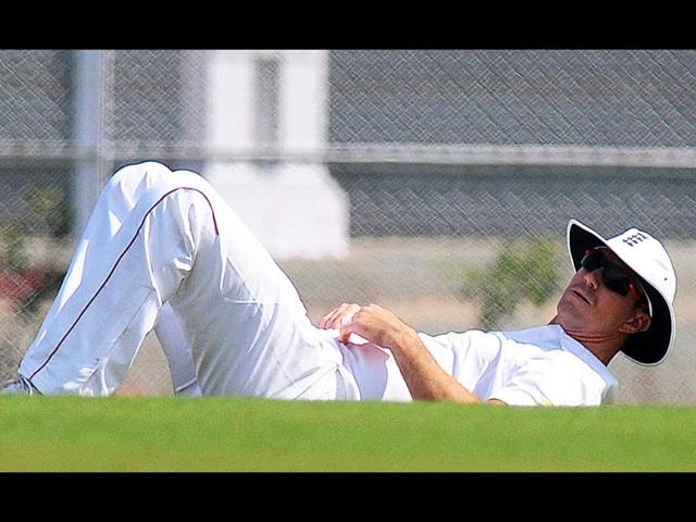 England cricketer Kevin Pietersen stretches during the first day of a three-day practice match between India A and England at the Cricket Club of India (CCI) grounds in Mumbai. AFP Photo/Pal Pillai