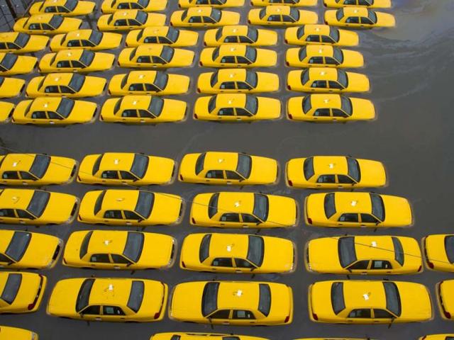 A parking lot full of yellow cabs is flooded as a result of superstorm Sandy in Hoboken, New Jersey. AP Photo