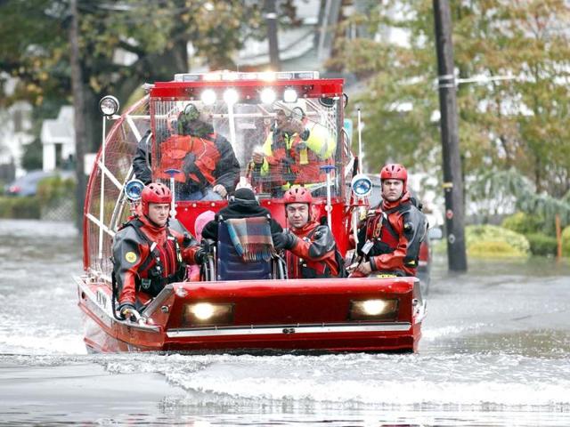 Rescue workers use a hovercraft to rescue a wheelchair-bound resident from flood waters brought on by Hurricane Sandy in Little Ferry, New Jersey. Reuters Photo