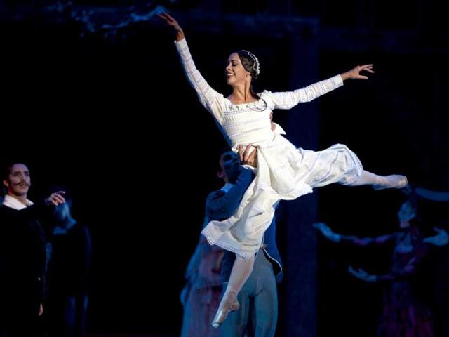Cuba's dancer Anette Delgado performs Shakespeare and his masks at the 'Karl Marx' theater in Havana. AP photo