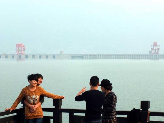 Visitors take photos at the Three Gorges Dam on the Yangzte River in Yichang, central China's Hubei province. AFP photo