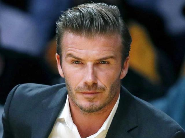 British soccer star David Beckham sits courtside as the Los Angeles Lakers play the Dallas Mavericks during their NBA basketball game in Los Angeles. Reuters photo