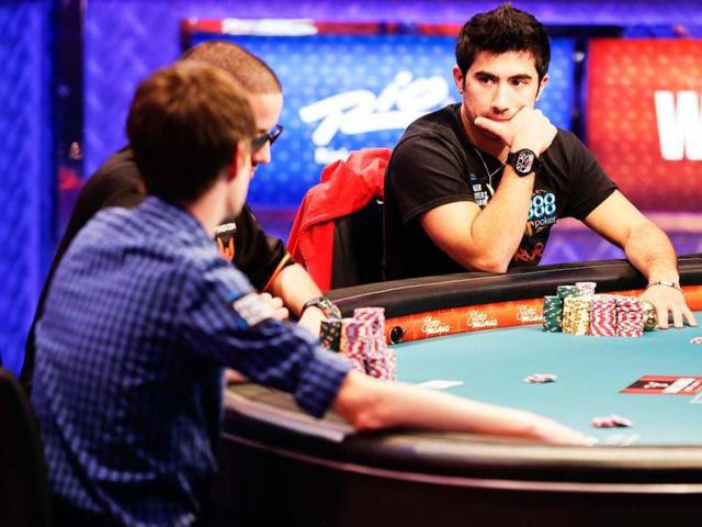 Jesse Sylvia, right, watches early play from opponents during the World Series of Poker Final Table event in Las Vegas. AP Photo/Julie Jacobson