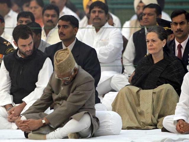 Congress President Sonia Gandhi, right, son Rahul Gandhi, left, and Vice President Hamid Asari attend the memorial service on the death anniversary of former Prime Minister Indira Gandhi in New Delhi. AP Photo