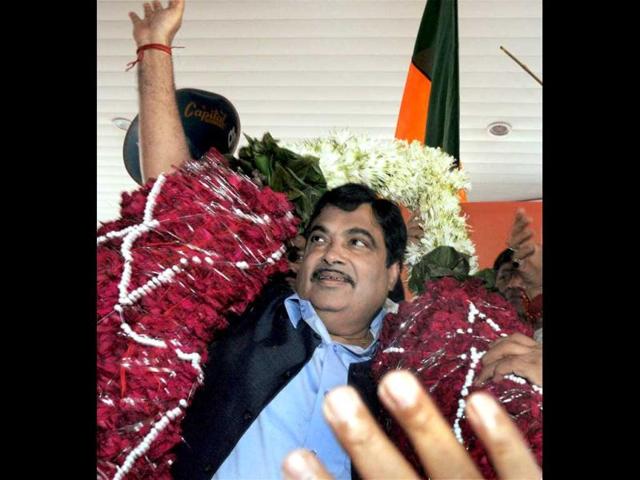 BJP President Nitin Gadkari being welcomed by the party workers on his arrival at the airport in Mumbai. PTI photo