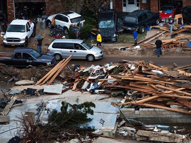 Residents return to their destroyed homes in Brighton, New York. Reuters/Adrees Latif