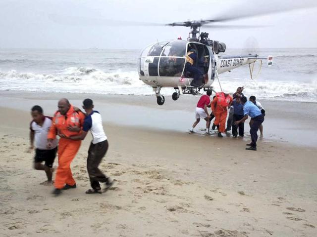 Indian Coast Guards lead crew members to safety on a rescue mission on the ship Pratibha Cauvery which ran aground due to strong winds on the Bay of Bengal coast, off Chennai. AP Photo