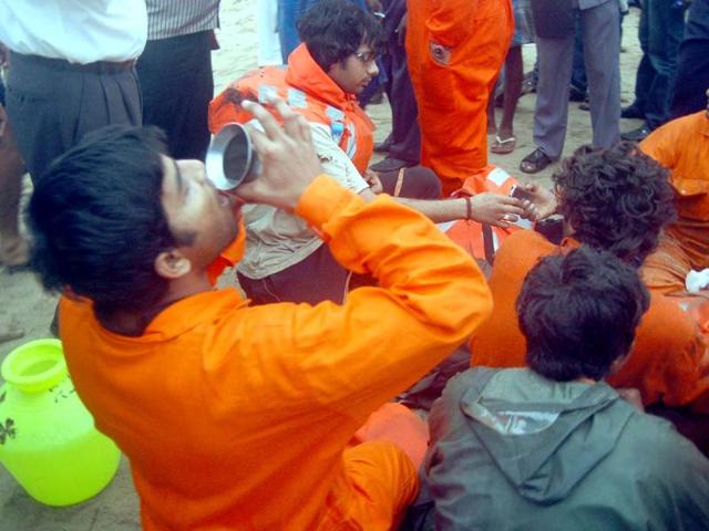 Crew members of ship Pratibha Cauvery after being rescued by Indian Coast Guard, The Ship ran aground off Marina Coast due to Cyclonic Storm ' Nilam ' , in Chennai . Agencies