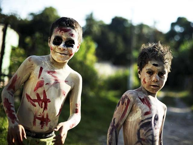 Young revellers get ready to take part in a parade called "La Calabiuza" on the eve of the Day of the Dead in Tonacatepeque, 20 kms (13 miles) north of San Salvador. AFP photo
