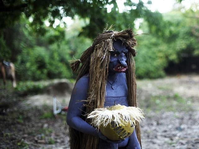 A young reveller waits to take part in a parade called "La Calabiuza" on the eve of the Day of the Dead in Tonacatepeque, 20 kms (13 miles) north of San Salvador. AFP photo