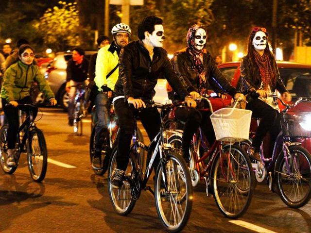 Cyclists with a "Calavera", or skull, painted on their faces participate in a Critical Mass Bike Ride across Lima to celebrate the Day of the Dead. Reuters photo