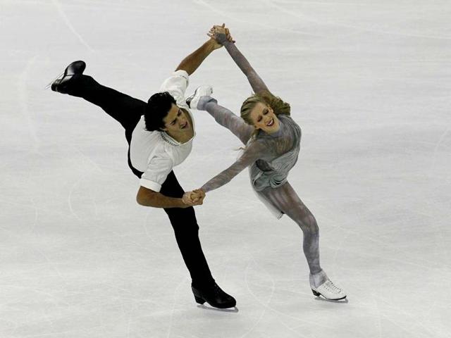 Canadians Kaitlyn Weaver and Andrew Poje perform during the Ice Dancing free dance at the ISU Grand Prix of Figure Skating Cup of China Figure Skating competition in Shanghai. AP photo