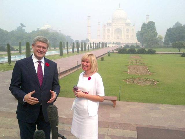 Canadian Prime Minister Stephen Harper (L) and his wife Laureen share a light moment while speaking with the media during their visit to the historic Taj Mahal in Agra. Reuters/Randall Palmer