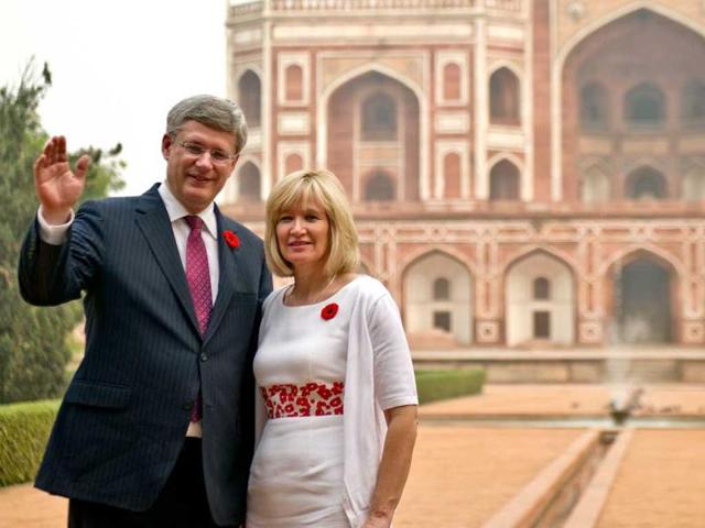 Prime Minister of Canada Stephen Harper (L) and his wife Laureen Harper pose for a photo at Humayun’s Tomb in New Delhi. AFP Photo/Prakash Singh