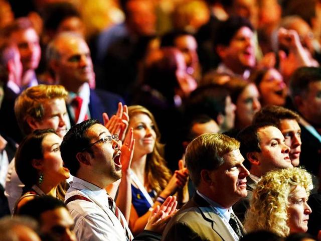 An attendee reacts in the crowd while watching election results displayed on a television during Mitt Romney's campaign election night event at the Boston Convention & Exhibition Center in Boston, Massachusetts. AFP photo