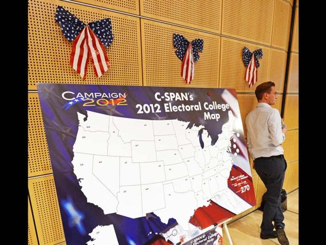 A man stands besides a US map during the 'Election Party' organized by the US consulate Leipzig to wait for the results of the 2012 in Leipzig, central Germany. AP Photo