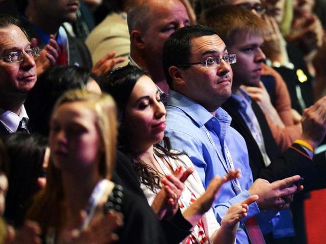 Supporters of US Presidential candidate Mitt Romney applaud as polling results show their candidate ahead on election night in Boston, Massachusetts. AFP photo.
