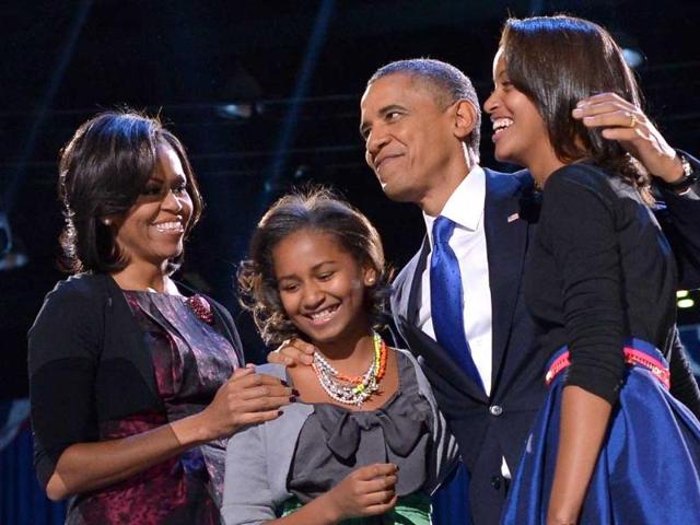 US-President-Barack-Obama-accompanied-by-First-Lady-Michelle-and-daughters-Sasha-and-Malia-appears-on-stage-on-election-night-in-Chicago-Illinois-AFP-photo-Jewel-Samad US-President-Barack-Obama-accompanied-by-First-Lady-Michelle-and-daughters-Sasha-and-Malia-appears-on-stage-on-election-night-in-Chicago-Illinois-AFP-photo-Jewel-Samad
