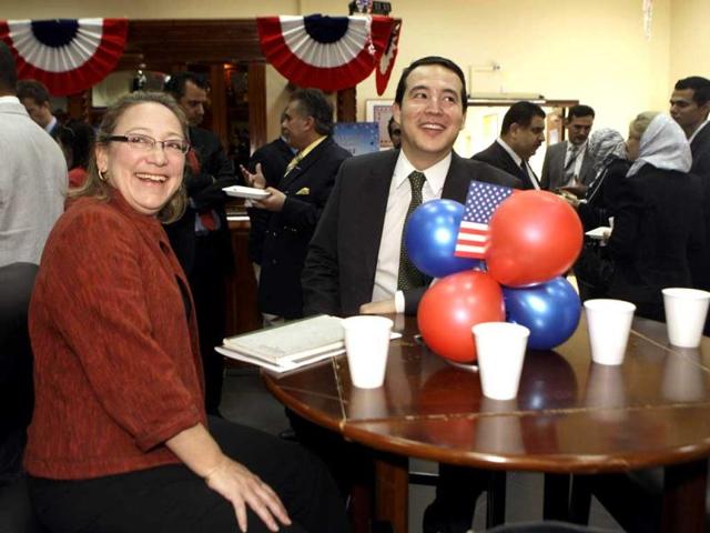 US embassy staff react after announcement of the re-election of US President Barack Obama at the US embassy in Baghdad. Reuters/Khalid Mohammed