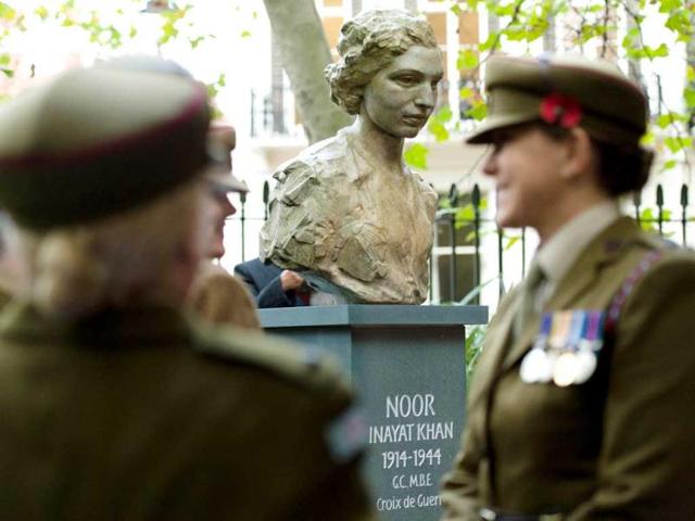 Members of the the First Aid Nursing Yeomanry (Princess Royal's Volunteer Corp) chat following a ceremony to unveil a statue of Noor Inayat Khan in Gordon Square Gardens, central London. AFP photo
