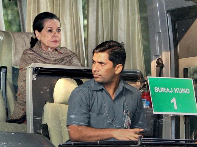 Congress President Sonia Gandhi sits inside a bus at AICC headquarters to leave for Surajkund to attend the party's 'Samvad Baithak'. PTI Photo by Kamal Singh