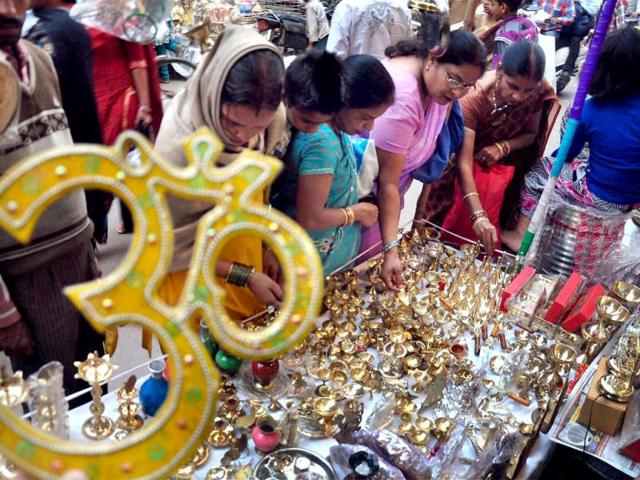 Women buy utensils on the occassion of Dhanteras at a market in Moradabad. PTI