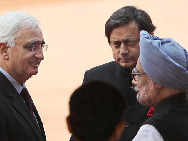 Prime Minister Manmohan Singh, external affairs minister Salman Khurshid and MoS for HRD Shashi Tharoor during a ceremonial reception for Afghan President Hamid Karzai at the forecourt of the Rashtrapati Bhavan in New Delhi. (PTI Photo)