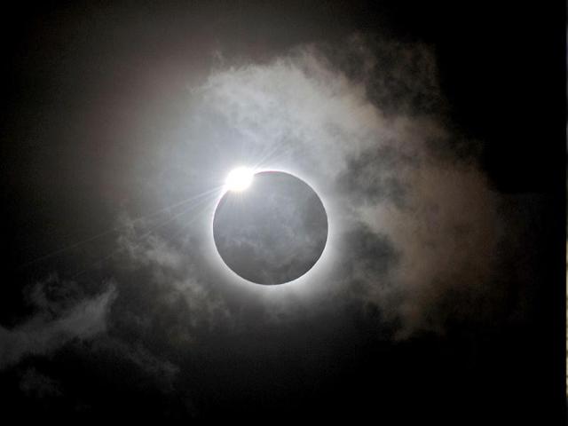 The Diamond Ring effect is shown following totality of the solar eclipse at Palm Cove in Australia's Tropical North Queensland. (AFP Photo)