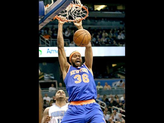 New York Knicks' Rasheed Wallace (36) dunks the ball in front of Orlando Magic's Glen Davis, left, during the first half of an NBA basketball game. (AP Photo)